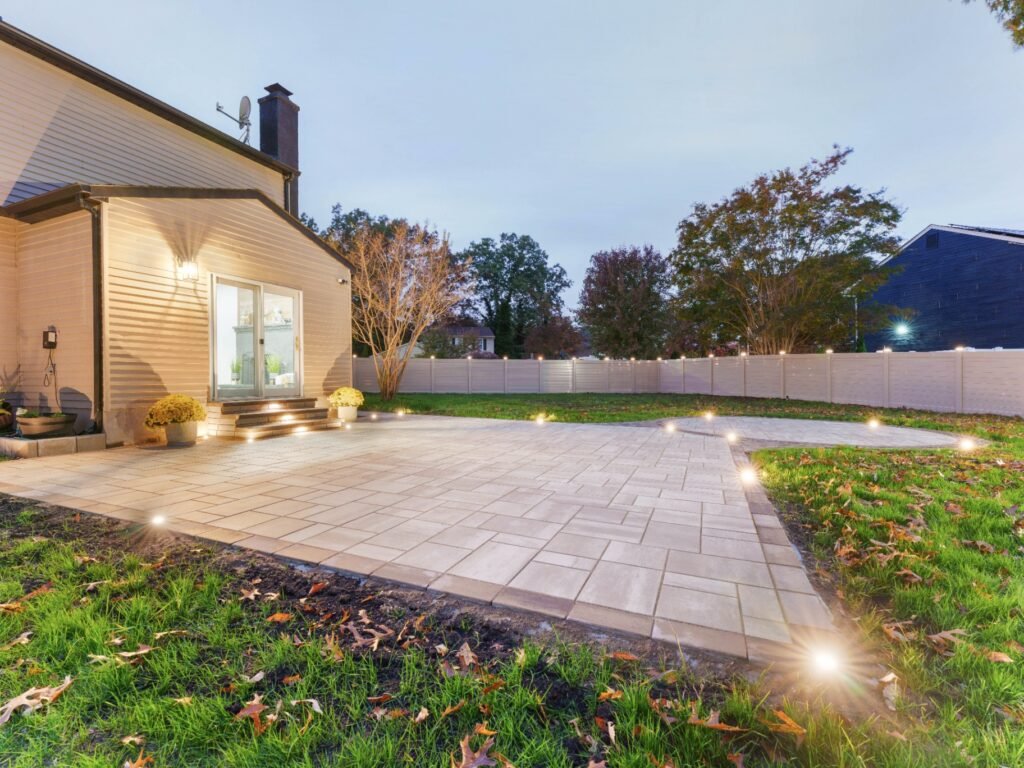 Finished paver patio at dusk built by G Brothers Construction